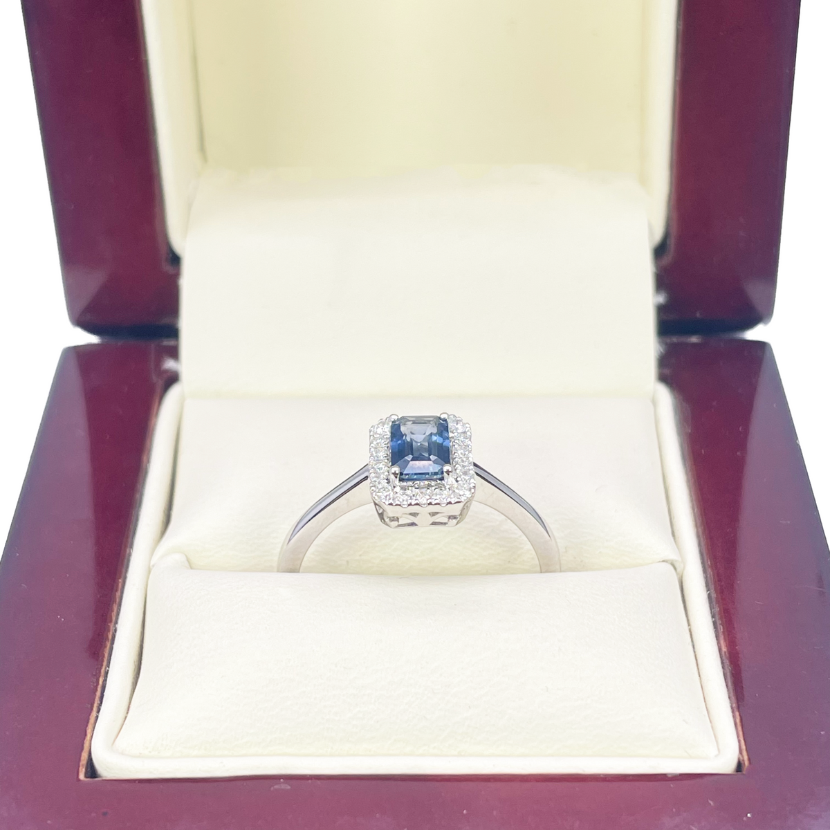 18ct White Gold Emerald Cut Blue Sapphire & Diamond Halo Ring 0.79ct